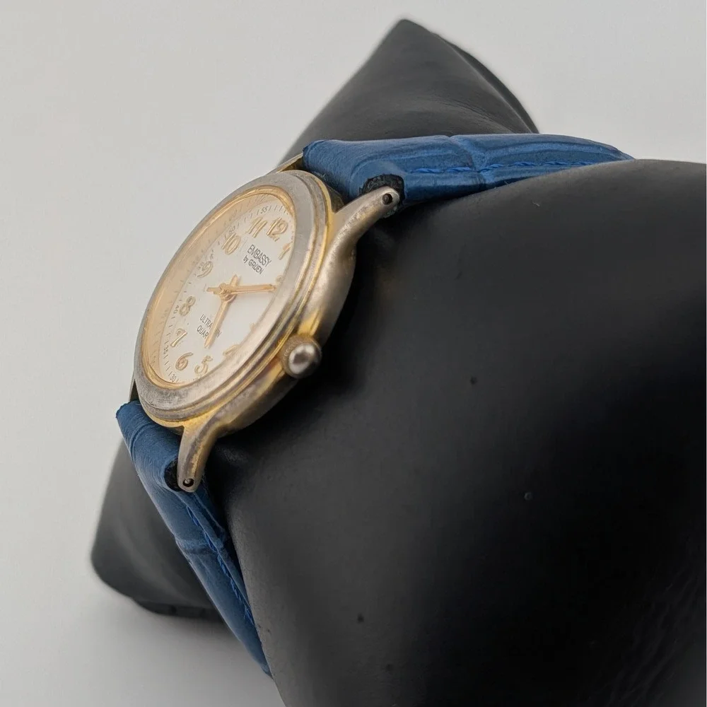 Embassy‎ by Gruen Ultra Thin Quartz Watch Gold Tone White Dial Blue Strap W1780